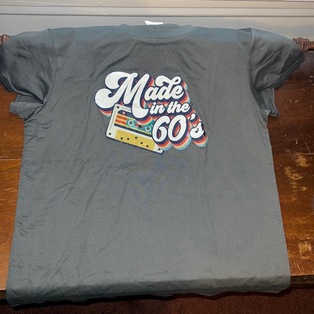 Made in the 60s women’s T-shirt says large, but is tight fit never worn